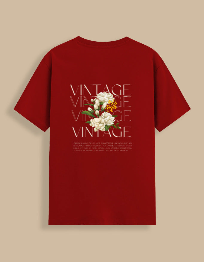 Red t-shirt with floral design and 'VINTAGE' text on a beige background