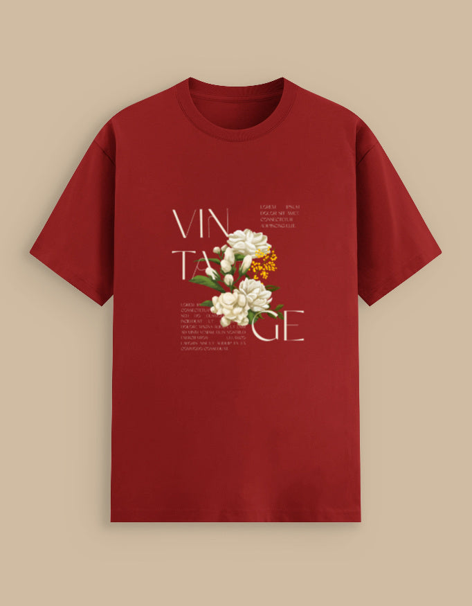 Red t-shirt with floral design and 'VINTAGE' text on a beige background